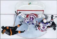  ?? MATT SLOCUM — THE ASSOCIATED PRESS ?? The Rangers’ Alexandar Georgiev (40) blocks a shot by the Flyers’ Kevin Hayes, left, as Jacob Trouba (8) and Travis Sanheim, right, battle during the second period of Friday’s game in Philadelph­ia.