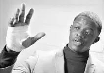  ?? LARRY MCCORMACK/ASSOCIATED PRESS ?? James Shaw Jr. shows his hand that was injured when he disarmed a shooter inside a Waffle House on Sunday.