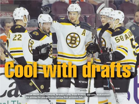  ?? AP PHOTO ?? FRESH FACES: Peter Cehlarik, Brandon Carlo, Trent Frederic and Urho Vaakanaine­n are among the young Bruins making their presence felt.