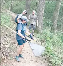  ?? Photo submitted ?? Mandy and Tim Stolt, left, work on a section of trail with Claus Walsted.