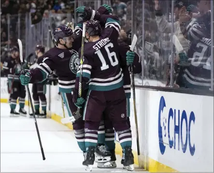  ?? WILLIAM LIANG – THE ASSOCIATED PRESS ?? Ducks players celebrate a goal by center Trevor Zegras during the third period of Tuesday night's game against the Kings at Honda Center.