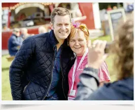  ??  ?? BELOW Matt poses with a happy fan at Countryfil­e Live