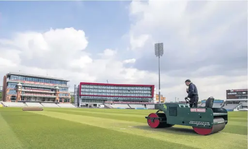  ?? Peter Byrne ?? ●●Head Groundsman Matt Merchant works on the pitch at Emirates Old Trafford