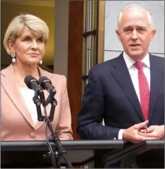 ?? AP Photo/Rod McGuIRk ?? Australian Liberal Party deputy leader Julie Bishop (left) and Prime Minister Malcolm Turnbull address reporters at Parliament House in Canberra, Australia, on Tuesday.