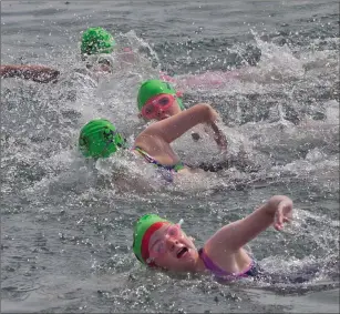  ?? PHOTOS BY PAUL MESSITT ?? The under-12 girls go for it in their sprint race.