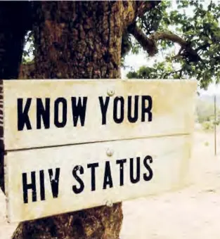  ??  ?? Sign promoting HIV testing in Zambia