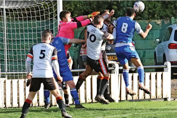  ?? Michael Bidny Published by MEN Media, Mitchell Henry House, Hollinwood Avenue, Chadderton, OL9 8EF. Printed by Reach Printing Services (Oldham) Limited, Hollinwood Avenue, Chadderton, Oldham OL9 8EB ?? ●●Bacup Borough goalkeeper Harry Turner punches clear while under pressure during the game against Nelson FC. See page 38