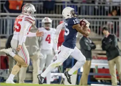  ?? ABBY DREY — CENTRE DAILY TIMES VIA AP, FILE ?? Penn State’s Grant Haley returns a blocked field goal for a TD against Ohio State last year in State College.