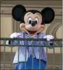  ?? TED SHAFFREY — THE ASSOCIATED PRESS, FILE ?? An actor dressed as Mickey Mouse greets visitors at the entrance to Magic Kingdom Park at Walt Disney World Resort on April 18, 2022, in