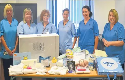  ??  ?? Maternity staff at Victoria Hospital in Kirkcaldy with the new baby boxes.