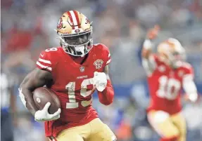  ?? TIM HEITMAN/USA TODAY SPORTS ?? 49ers wide receiver Deebo Samuel runs for a touchdown in the wild-card game against the Cowboys.