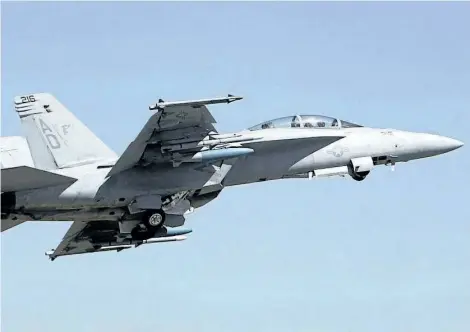  ?? THE CANADIAN PRESS FILES ?? A U. S. Air Force F-18 Super Hornet fighter aircraft takes off in India in 2011. The plane’s manufactur­er, Boeing, still hopes to sell 18 Super Hornets to Canada despite the company’s dispute with Bombardier. The Liberal government threatened last...