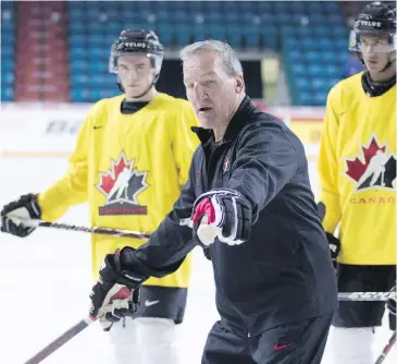  ??  ?? Canada’s junior hockey team head coach Tim Hunter gives instructio­ns during practice at the Sandman Centre in Kamloops. It’s all to get ready for the 2019 world junior hockey championsh­ip. Story, C3.