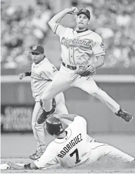  ?? DUANE BURLESON/AP FILE ?? Omar Vizquel avoids the sliding Ivan Rodriguez in a bid to turn a double play during a 2004 game between the Indians and Tigers. With 11 Gold Gloves, Vizquel trails only Ozzie Smith among shortstops.