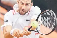  ?? — Gambar AFP ?? TETAP TANGKAS: Aksi Djokovic pada perlawanan Terbuka Itali menentang Fritz di Rome, Itali.