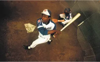  ?? Associated Press 1974 ?? In addition to hitting 755 home runs, Hank Aaron amassed a majorleagu­e record 2,297 RBIs in his 23 seasons. After retiring as a player, he served as an executive with the Atlanta Braves.