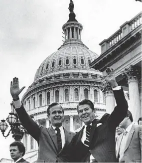  ?? JAMES K.W. ATHERTON/THE WASHINGTON POST ?? George H.W. Bush, with president-elect Ronald Reagan, visits Capitol Hill after the 1980 election. Bush served eight years as vice president under Reagan before succeeding him.