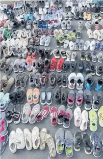  ?? ?? Gym shoes of all brands and conditions are being collected through April 24 at drop-off sites in Chicago and throughout the south suburbs to benefit Oak Lawn-based Christmas Without Cancer.