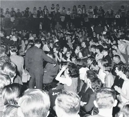  ??  ?? 0 The photograph­s of the Beatles’ last gig at Dundee’s Caird Hall, on 20 October 1964 include pictures of John, Paul, George and Ringo relaxing backstage and screaming fans overcome with emotion at the band’s appearance