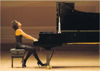  ?? IAN DOUGLAS / TORONTO SYMPHONY ORCHESTRA ?? Yuja Wang met the concert’s interpreti­ve challenges with a mixed degree of success, but the 28-year-old’s powerful and entertaini­ng performanc­e earned multiple standing ovations.