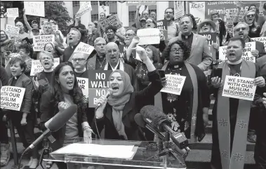  ?? KAREN DUCEY / GETTY IMAGES VIA AGENCE FRANCE-PRESSE ?? Varisha Khan from the group OneAmerica speaks to a crowd in reaction to the US Supreme Court ruling upholding the travel ban onTuesday, in Seattle, Washington state.