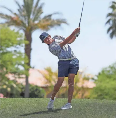  ?? JAY CALDERON/THE DESERT SUN ?? Landon Breisch, who plays for Palm Desert High School, hits an approach shot on the 1st hole at Andalusia during the U.S. Open local qualifier on May 7 in La Quinta, Calif.