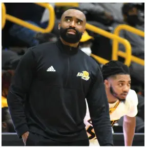  ?? (Pine Bluff Commercial/I.C. Murrell) ?? UAPB men’s basketball Coach Solomon Bozeman looks up, with guard Shawn Williams behind him, during Monday’s home game against Arkansas Baptist College.