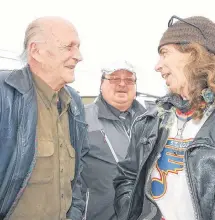  ?? JIM DAY/SALTWIRE NETWORK ?? Bill Francis, right, was one of many current or former cabbies to show up Friday to give Neil Harpham, left, an emotional send-off shortly before Harpham ended his life by medically assisted suicide.