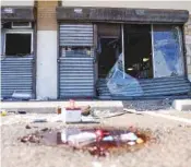  ?? AP PHOTO/MATT ROURKE ?? The aftermath of a ransacked liquor store is shown Sept. 27 after a group of people reportedly looted it in Philadelph­ia.