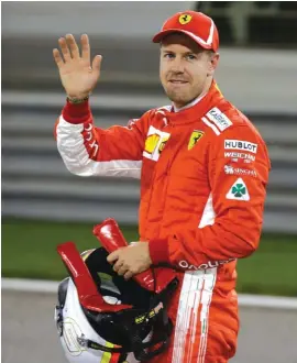  ??  ?? Ferrari driver Sebastian Vettel of Germany celebrates after getting the pole position Photo: AP