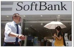  ?? (AP/Koji Sasahara) ?? SoftBank said Monday that it would sell up to $41 billion in assets and use the proceeds to buy its own stock, pay down debt and raise its credit rating.