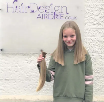  ??  ?? A cut above St Edward’s Primary School pupil Katie had 14 inches of her lovely locks chopped off