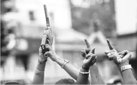  ?? PHOTO: PTI ?? Congress workers hold a refuelling machine in Bengaluru during the Bharat bandh