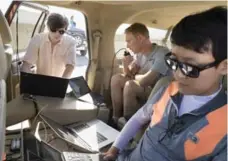  ?? JOHN BRECHER/MICROSOFT VIA THE NEW YORK TIMES ?? Andrey Kolobov, left, Iain Guilliard and Sangwoo Moon monitor a glider.