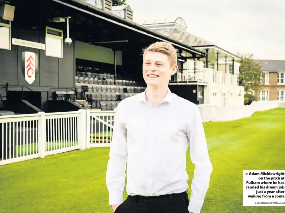  ?? Clint Randall/SWNS.COM ?? Adam Micklewrig­hton the pitch at Fulham where he has landed his dream jobjust a year after waking from a coma