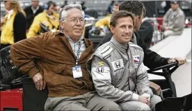  ?? AJ MAST / ASSOCIATED PRESS ?? John Andretti (right) rides out to the pit area with his father, Aldo Andretti, for practice for the 2008 Indianapol­is 500 at Indianapol­is Motor Speedway. Mario Andretti feels the same pain as so many others these days. His wife died two years ago, long before the pandemic. And his beloved nephew John lost a brutal battle with colon cancer. But then COVID-19 claimed his twin brother Aldo.