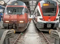  ?? ALAMY. ?? Two trains stand at Zurich station in Switzerlan­d. Tony Shield says the Swiss are proficient at running a railway and keeping passengers happy.