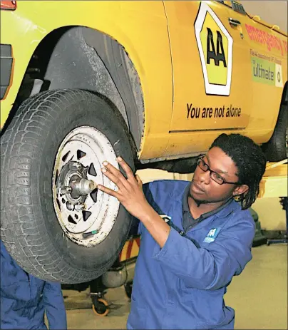  ??  ?? SHOULDER TO THE WHEEL: Motor mechanic students get familiar with the tools of their trade.