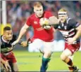  ?? MICHAEL BRADLEY/AFP ?? Ross Moriarty (centre) charges forward during the rugby match between New Zealand’s Provincial Barbarians and the British and Irish Lions in Whangarei on June 3.