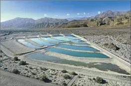  ?? Carolyn Cole Los Angeles Times ?? GROUNDWATE­R depletion is a serious concern in California. Above, Colorado River water is routed to ponds at a replenishm­ent facility in La Quinta.