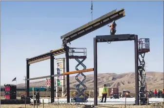  ?? Gary Friedman Los Angeles Times ?? CONSTRUCTI­ON is underway on the Outlets at Tejon Ranch, which will have 320,000 square feet of stores laid out in an oval shape. The site is near where Interstate 5 and Highway 99 meet.