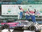  ?? JOHN RAOUX/AP ?? Drivers, from left, Tom Blomqvist, Colin Braun, Helio Castroneve­s and Simon Pagenaud celebrate Sunday after winning the Rolex 24 at Daytona.