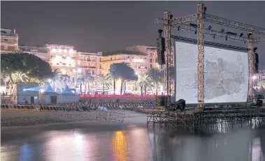  ??  ?? BEACH FLICKS: Cinema de la plage, or cinema on the beach, which opens to the public during the Cannes Film Festival every May.