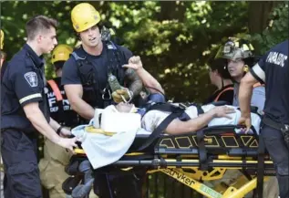  ?? HAMILTON SPECTATOR FILE PHOTO ?? A man gives emergency crews the thumbs-up as he’s rescued from the escarpment this past August. There have been at least 22 rope rescue calls in Hamilton so far this year — more than last year’s total count of 19.