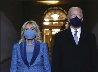  ?? THE ASSOCIATED PRESS ?? President-elect Joe Biden and Jill Biden arrive at Biden’s inaugurati­on on the West Front of the U.S. Capitol on Wednesday.