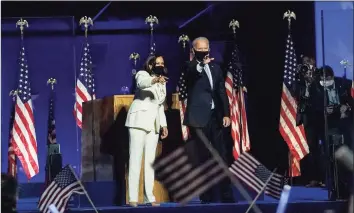  ?? Toni L. Sandys / The Washington Post ?? President-elect Joe Biden and Vice President-elect Kamala Harris celebrate at the Chase Center in Wilmington, Del., Saturday night.