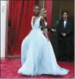  ?? PHOTO BY JORDAN STRAUSS — INVISION — AP, FILE ?? Lupita Nyong’o arrives at the Oscars in Los Angeles. Nyong’o, wearing a light blue Prada gown, won the Oscar for best supporting actress for her role in “12 Years a Slave.”