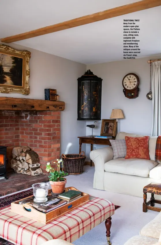  ??  ?? TRADITIONA­L TWIST Away from the modern open-plan spaces, the Pattens chose to include a cosy, sitting room, complete with inglenook fireplace and woodburnin­g stove. Many of the antiques around the house were sourced via Fiona’s shop, The Confit Pot.