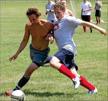  ?? Montgomery Media / BOB RAINES ?? Upper Dublin players battle for a loose ball during preseason practice.