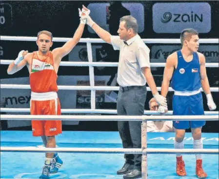  ?? PTI ?? ■
Boxer Amit Panghal (left) is one of the bright hopes for India going into the Tokyo Olympics.